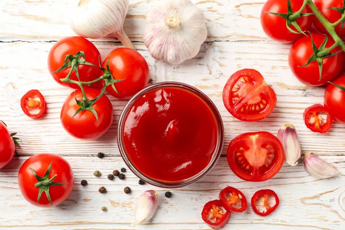 Composition with tomatoes on wooden background, top view