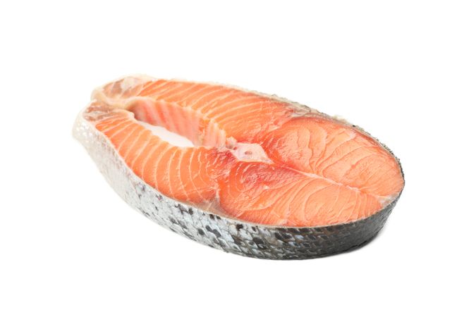 Fresh raw salmon meat isolated on light background