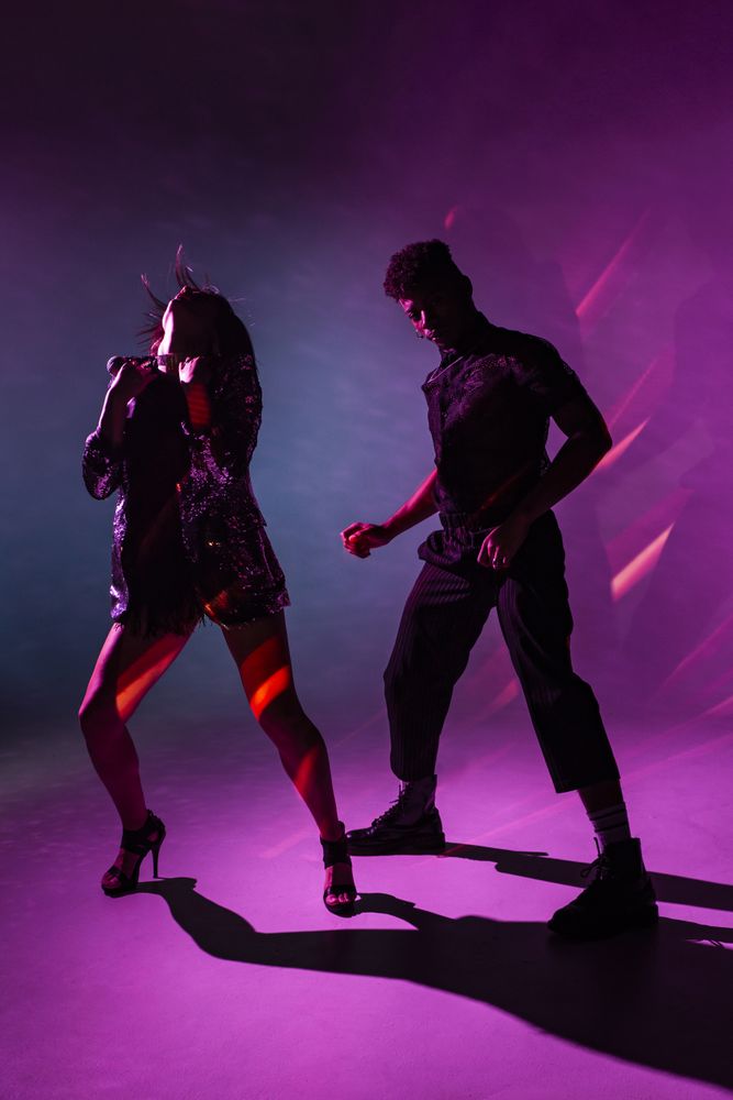 young dancers near smoke