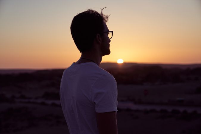 Man admiring sunset in nature