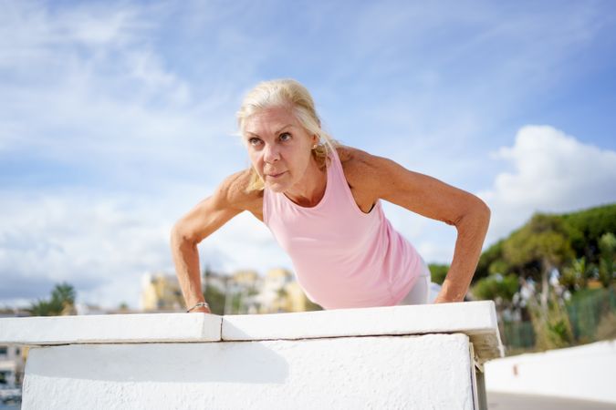 Female doing push ups or press ups exercise