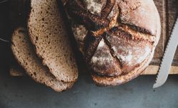 Freshly baked sourdough bread loaf, sliced, close up
