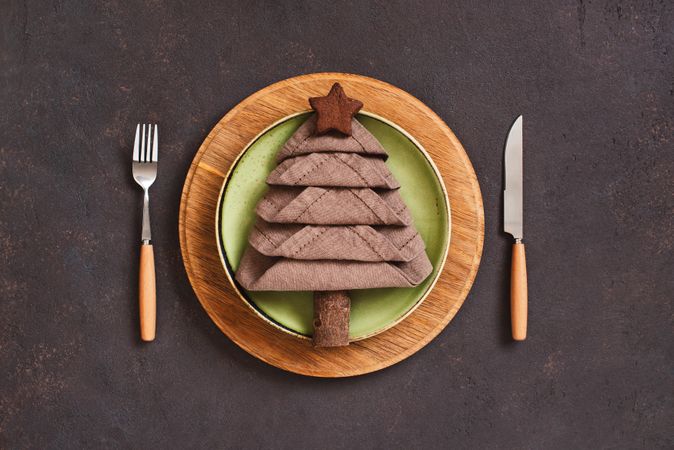 Holiday table setting with napkin in the shape of a tree