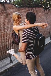 Happy couple having fun while walking in town