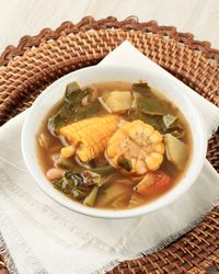 Bowl of Indonesian stew sayur asem with corn and greens