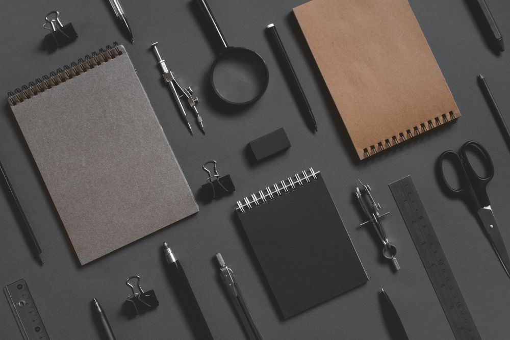Stationary organized neatly on dark background