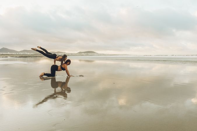 Women exercising near sea