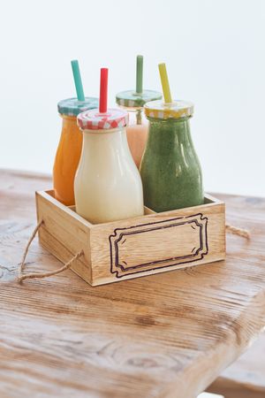 Set of assorted smoothies in wooden box