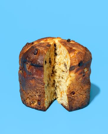 Homemade panettone in bright light on a blue background