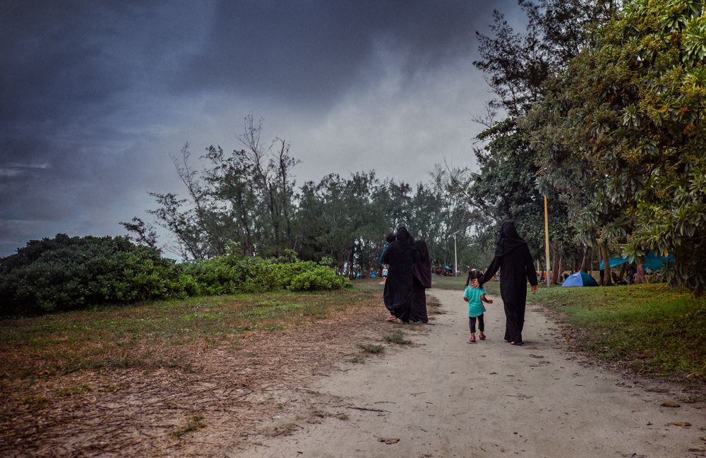 Women walking with daughter in a park