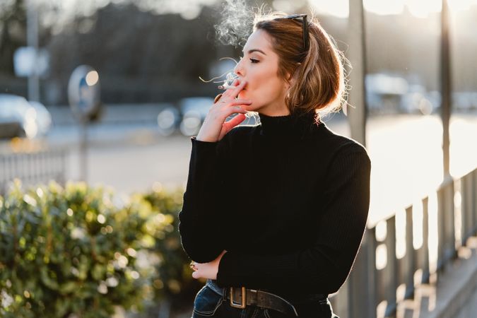 woman smoking on street