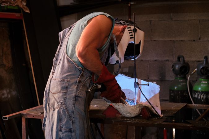 Craftsman during process of welding