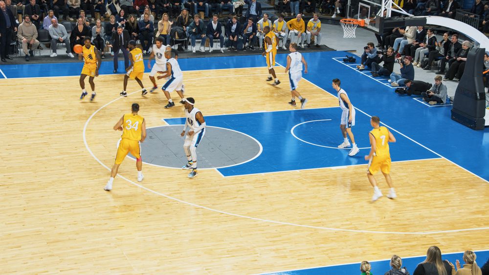 TV Broadcast Style Footage Of Basketball Championship: Yellow Team Passing the Ball Between Teammates