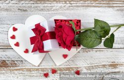 Valentine’s card with open gift box and single red rose bxBaZ5