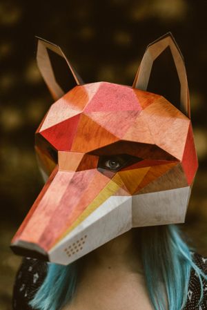 Enigmatic woman in red fox mask