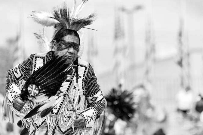 Red Wing, MN, USA - July 8th, 2017: Sioux man in traditional regalia and headdress with feathers