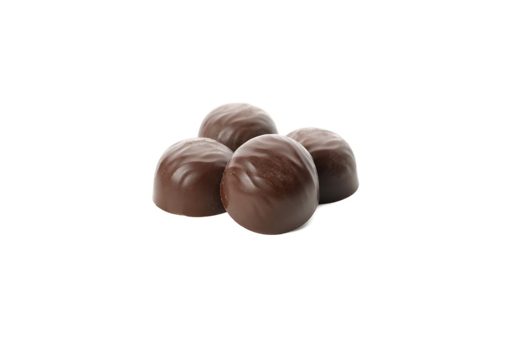 Tasty chocolate candies isolated on blank background