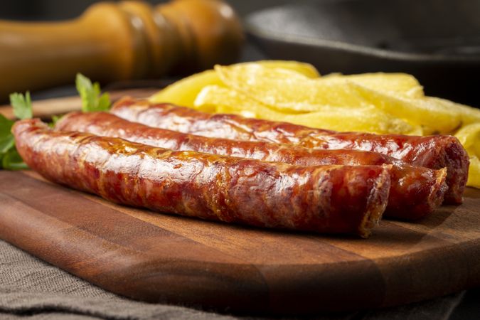 Grilled German sausage with french fries.