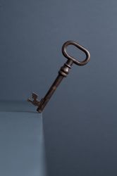 Vintage Key in balance at the edge of the table
