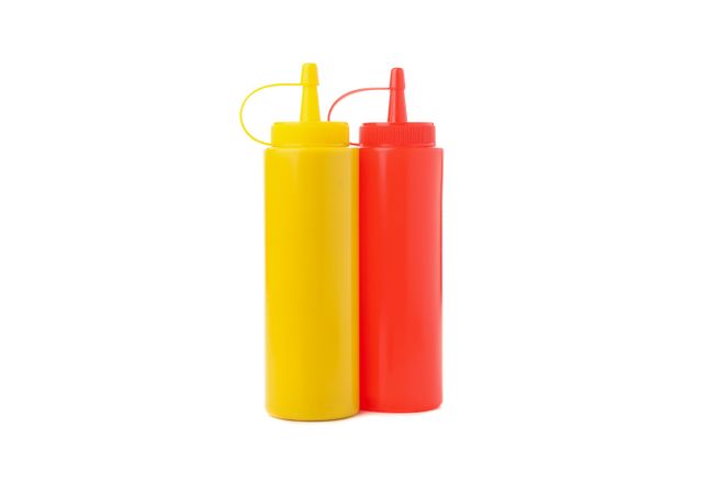 Mustard and ketchup bottle isolated on plain background