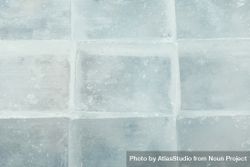 Top view, close up of rows of tightly stacked square ice cubes bGk6eb