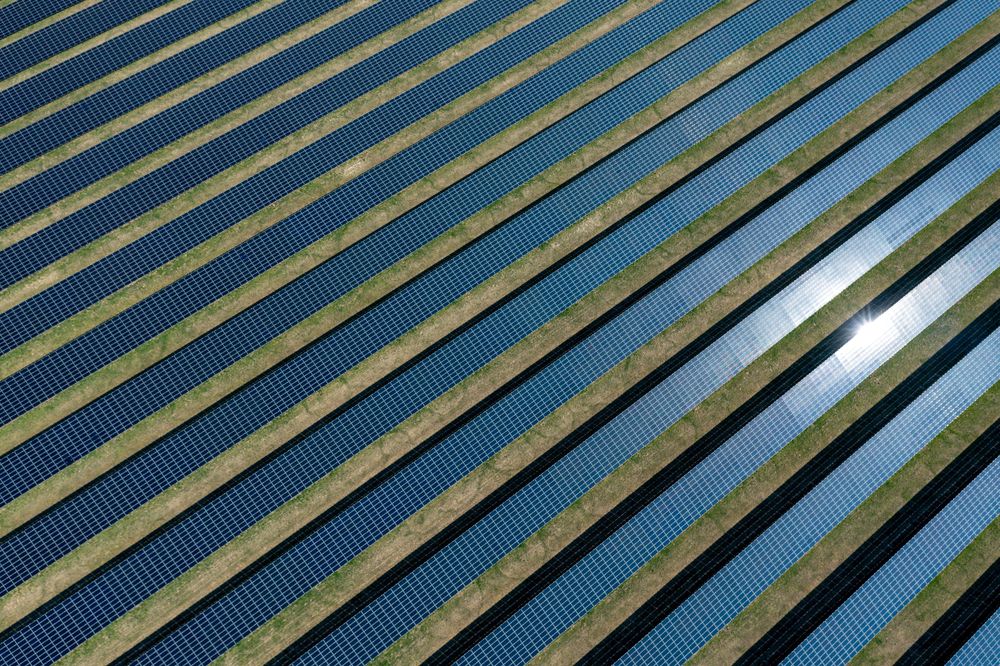Solar panels farm in Germany, drone aerial view on a sunny day