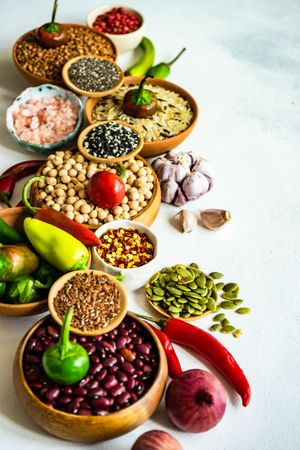 Bowls of legumes and grains on counter