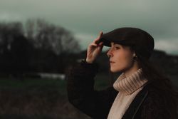 Young woman in warm clothes in forest