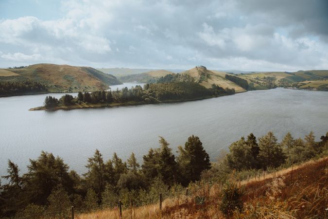 Majestic view of lake surrounded by hills