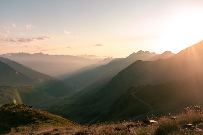 Mysterious mountain high in row in sunlight