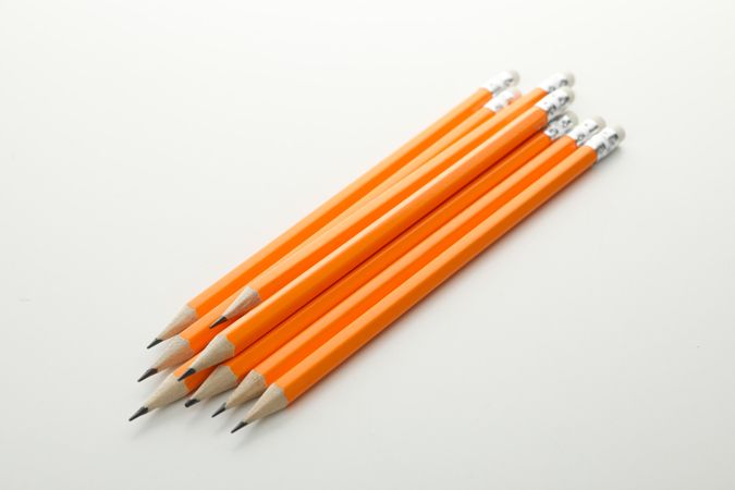 Orange office pencils isolated on plain background
