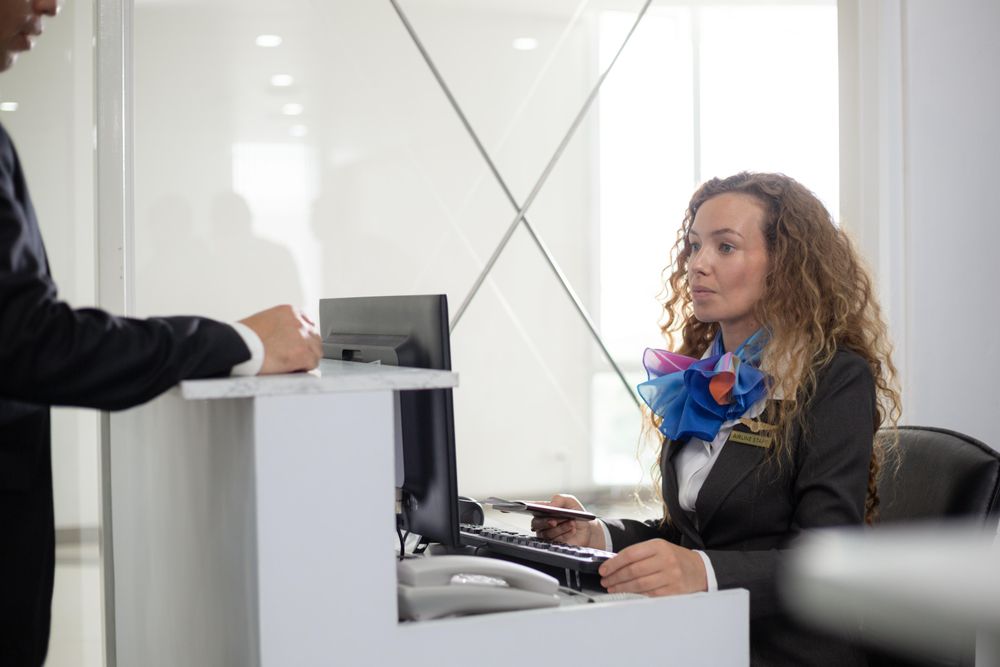 Passenger visiting check in desk in airport