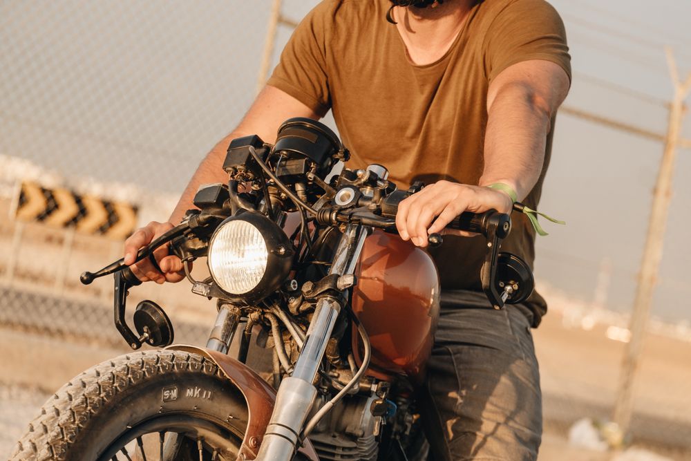 Strong man driving motorcycle
