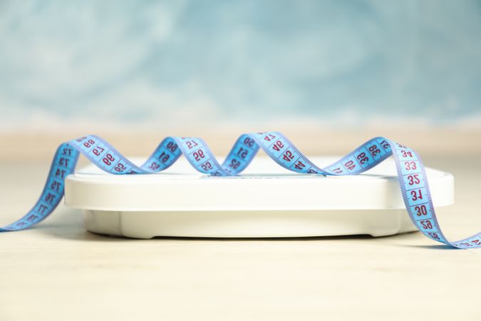 Scales and measuring tape. Weight loss concept