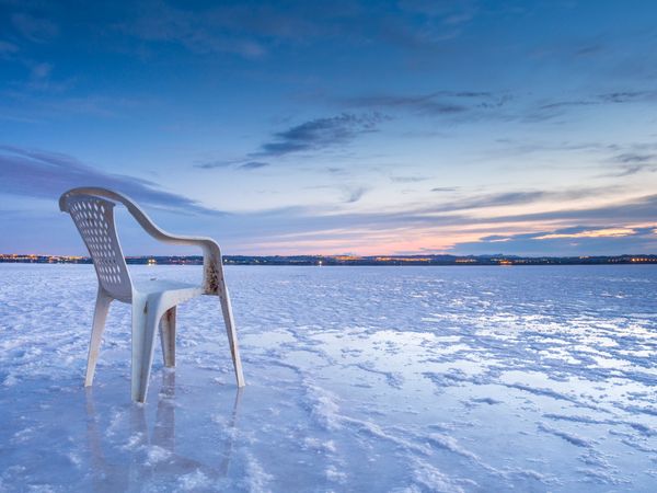 Chair on salt mine during sunset