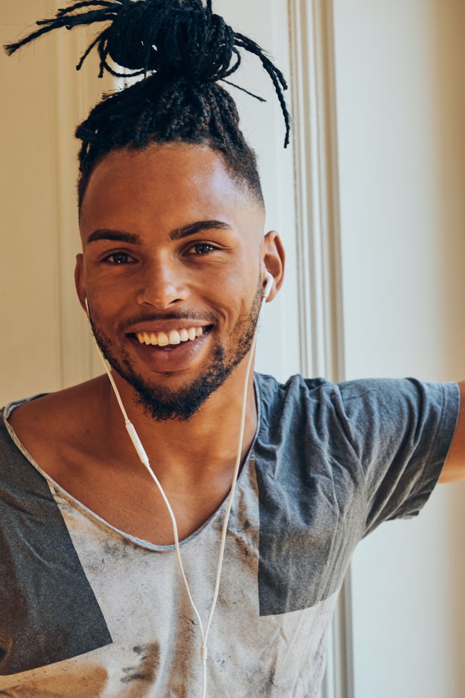 Black man looking out window
