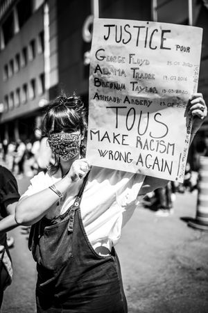 MONTREAL, QUEBEC, CANADA – June 7 2020- protester holding a justice sign during a BLM rally