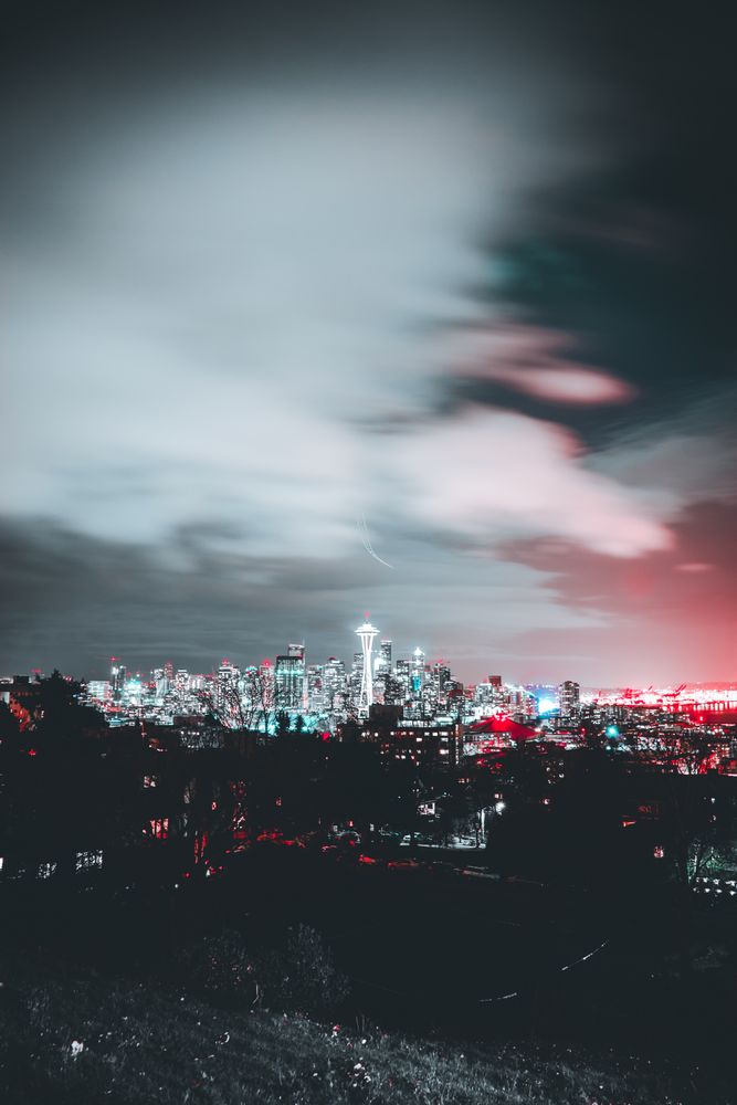 City with high rise buildings during night time in Washington State, USA