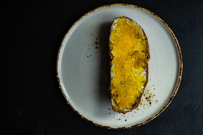 Yellow trout caviar on toast
