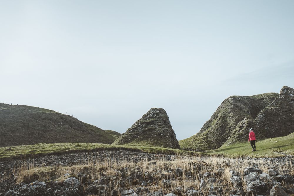Woman walking along mountain