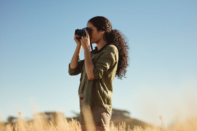 Woman photographer doing nature photography on a holiday