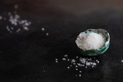 Sea salt in bowl with copy space