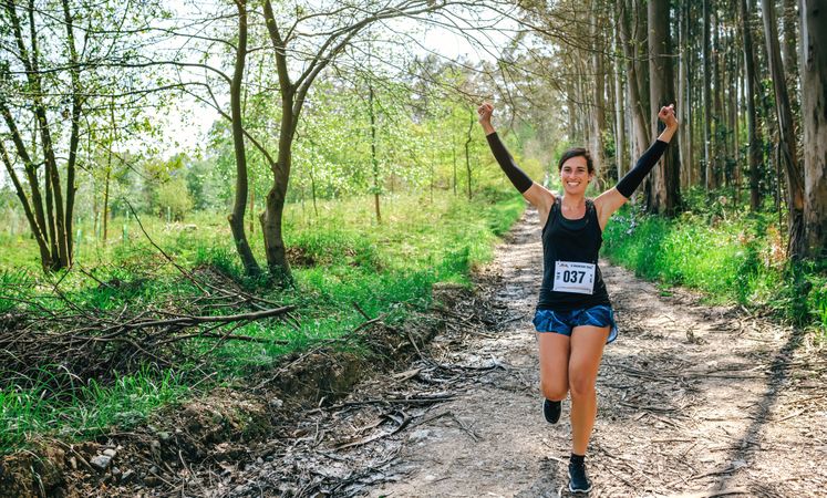 Young woman winning trail race