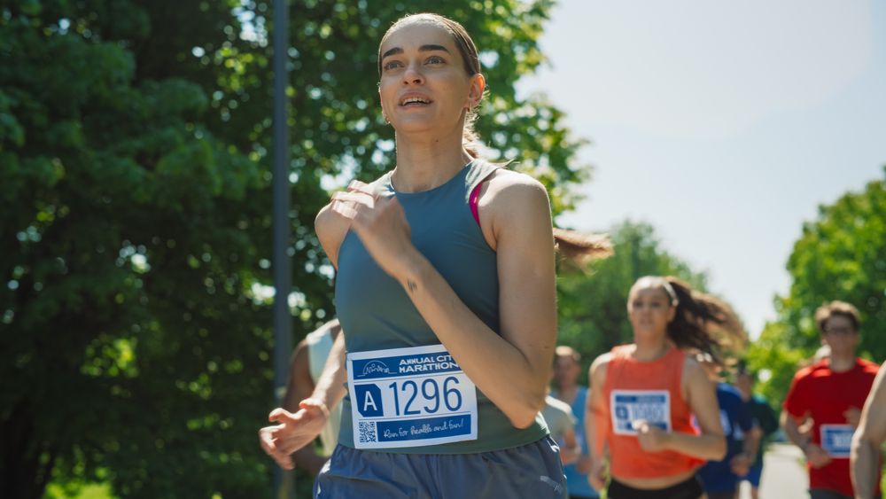 Portrait of a Woman Running and Participating in a Marathon in a Park.