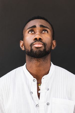 Black man in trendy clothes in city