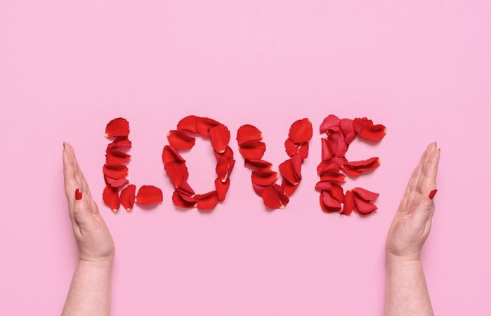 Love word with rose petal letters