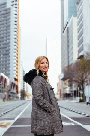 Blonde woman posing in the city