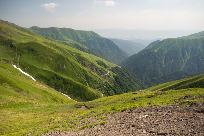 Wonderful view of foggy valley with lush greenery