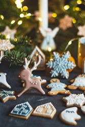 Cute little gingerbread cookies on dark tablecloth