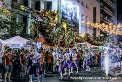 People performing the Dragon Dance at night during Chinese New Year in Bangkok, Thailand 5zmYo0